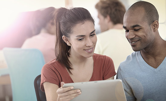 A colleague showing another colleague a presentation she has prepared