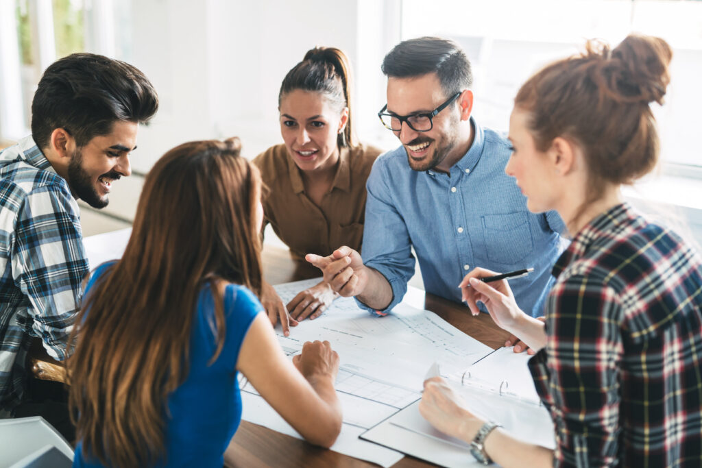 Image of business partners discussing documents and ideas