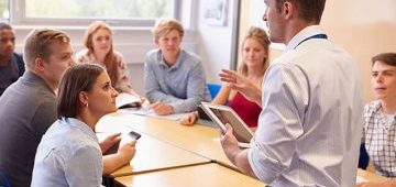 A team meeting with one member presenting